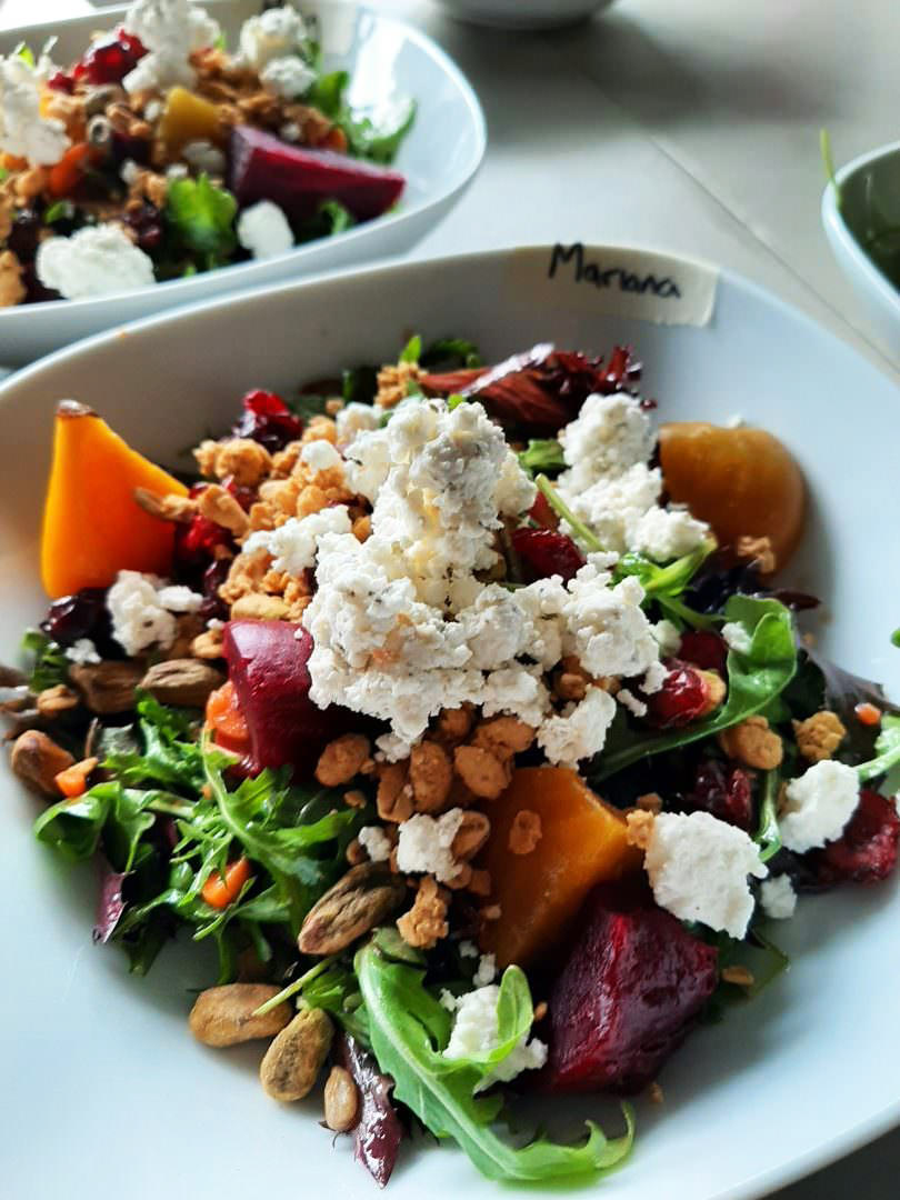 Arugula-beet salad with pistachios, dried cranberries, and crumbled goat cheese.