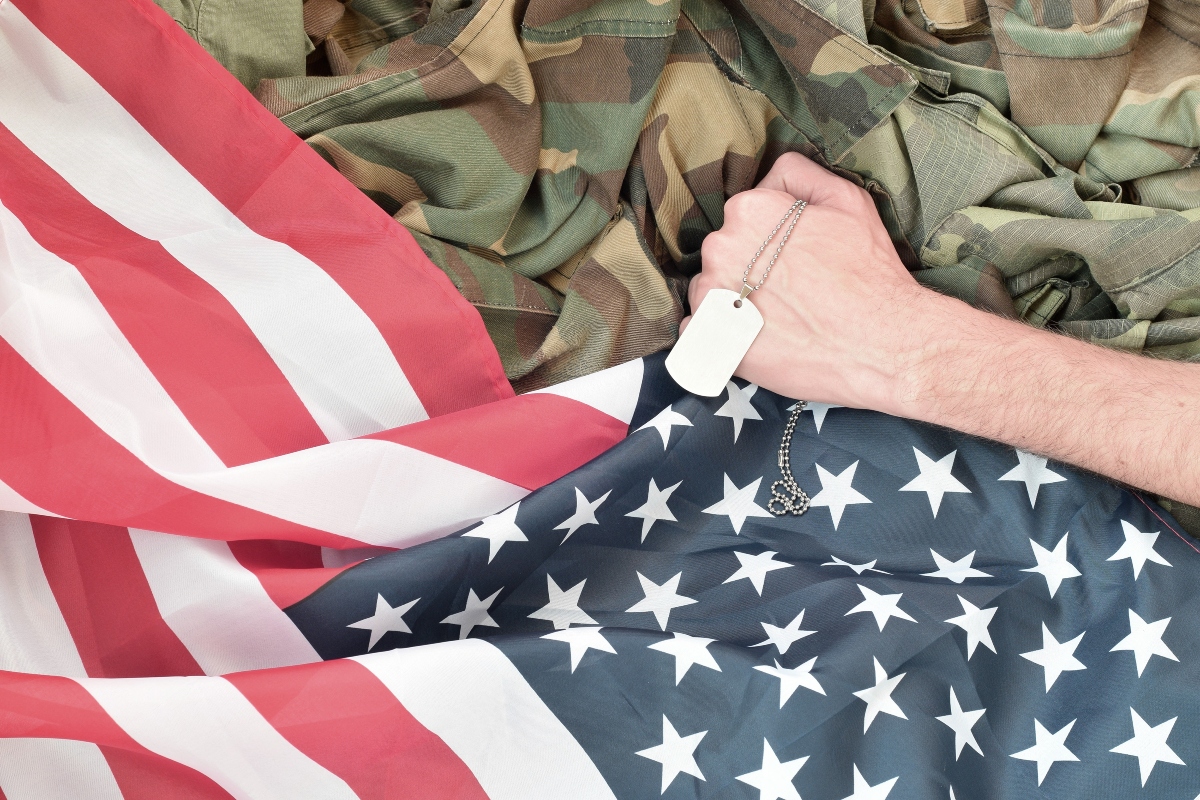 hand holds a tag and a USA FLAG